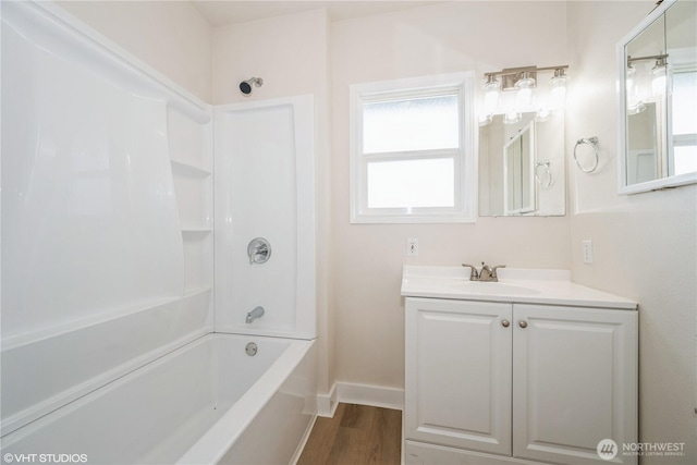 211 Yew St, Centralia, WA 98531 - full bath featuring shower / bath combination, vanity, baseboards, and wood finished floors