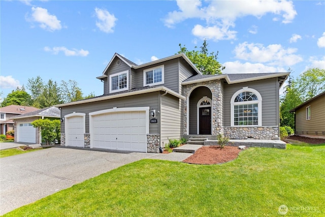 18431 Newport Dr, Arlington, WA 98223 - view of front of property featuring stone siding, a front yard, an attached garage, and driveway
