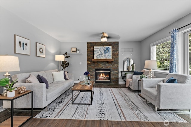 18431 Newport Dr, Arlington, WA 98223 - living room featuring a ceiling fan, a fireplace, and wood finished floors