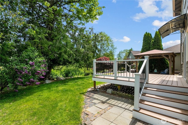 18431 Newport Dr, Arlington, WA 98223 - view of green lawn with a gazebo, a deck, and stairs