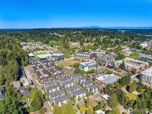 birds eye view of property with a view of trees