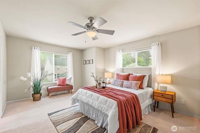 bedroom featuring ceiling fan, carpet floors, and baseboards