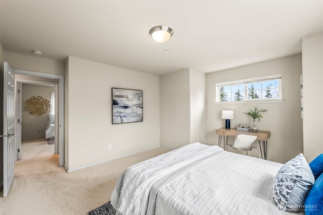 bedroom featuring light colored carpet