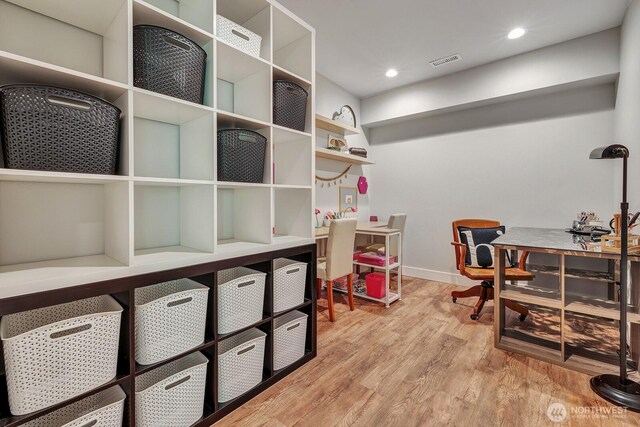 office with recessed lighting, baseboards, light wood-type flooring, and visible vents