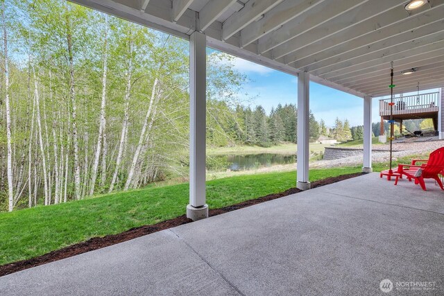 view of patio with a water view