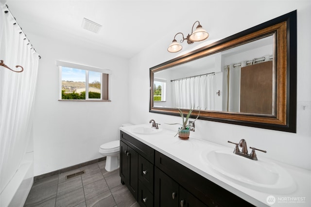 full bathroom featuring toilet, baseboards, visible vents, and a sink