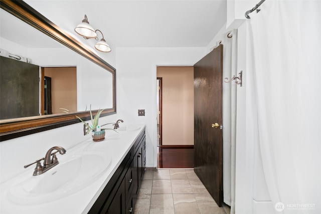 bathroom featuring double vanity and a sink