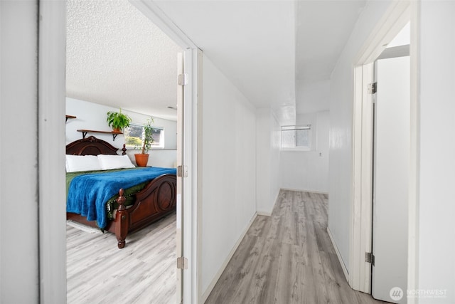 corridor with wood finished floors