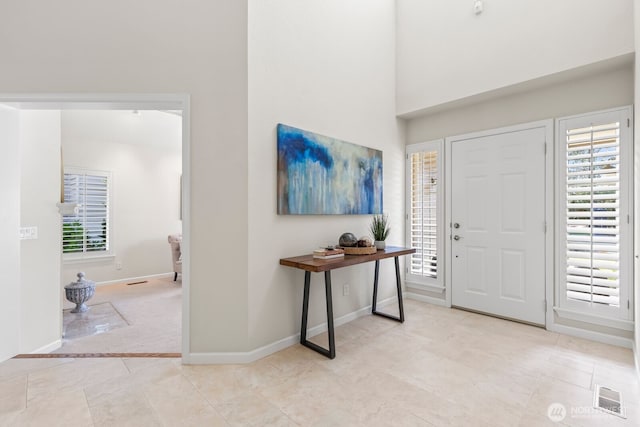 1208 N 20th Ave, Yakima, WA 98902 - foyer entrance with a wealth of natural light, visible vents, and baseboards