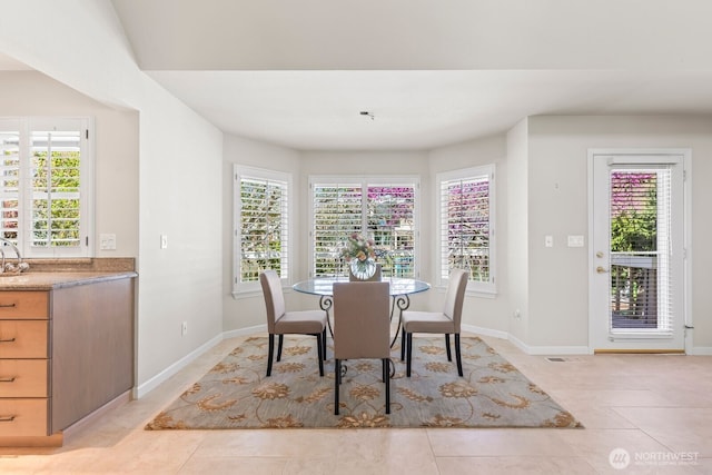 1208 N 20th Ave, Yakima, WA 98902 - dining room featuring baseboards, visible vents, and light tile patterned floors
