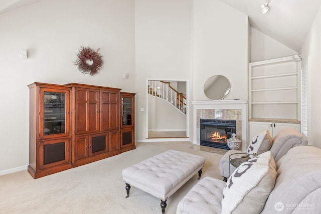 1208 N 20th Ave, Yakima, WA 98902 - living area featuring high vaulted ceiling, light carpet, and a fireplace