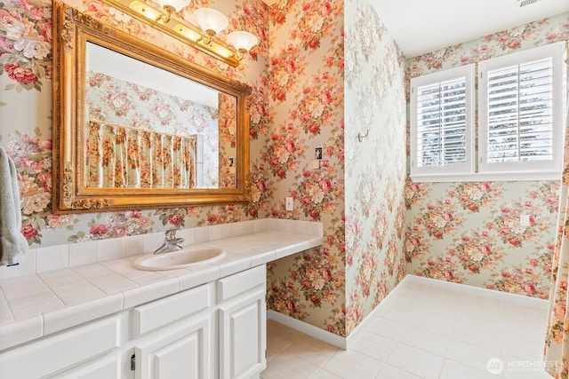 1208 N 20th Ave, Yakima, WA 98902 - bathroom with baseboards, wallpapered walls, tile patterned flooring, and vanity