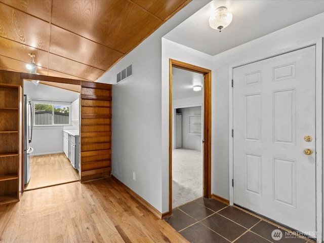 2909 SW 116th St, Burien, WA 98146 - foyer with lofted ceiling, baseboards, light wood finished floors, and wood ceiling