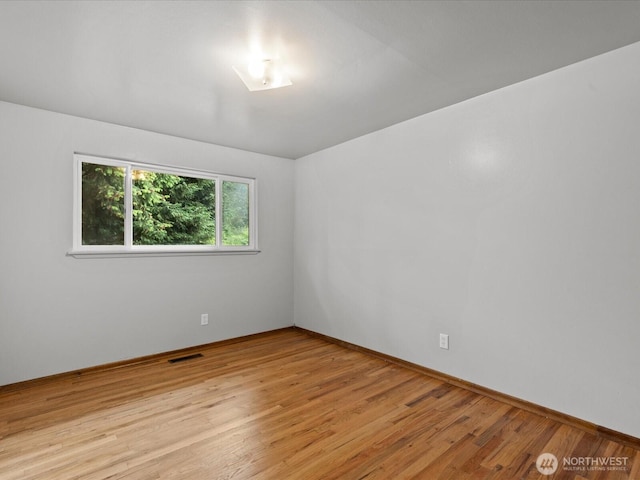 2909 SW 116th St, Burien, WA 98146 - spare room with light wood-type flooring and baseboards