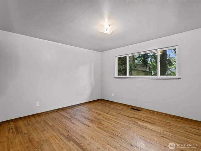 2909 SW 116th St, Burien, WA 98146 - spare room with wood finished floors and baseboards