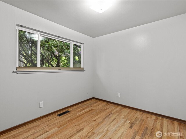 2909 SW 116th St, Burien, WA 98146 - empty room with light wood-style flooring and baseboards