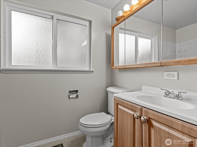 2909 SW 116th St, Burien, WA 98146 - bathroom featuring vanity, toilet, and baseboards