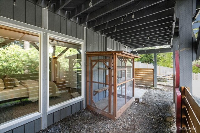 exterior space with exterior structure and fence