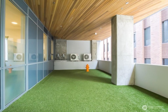 121 Stewart St Unit 905, Seattle, WA 98121 - unfurnished sunroom featuring independent washer and dryer