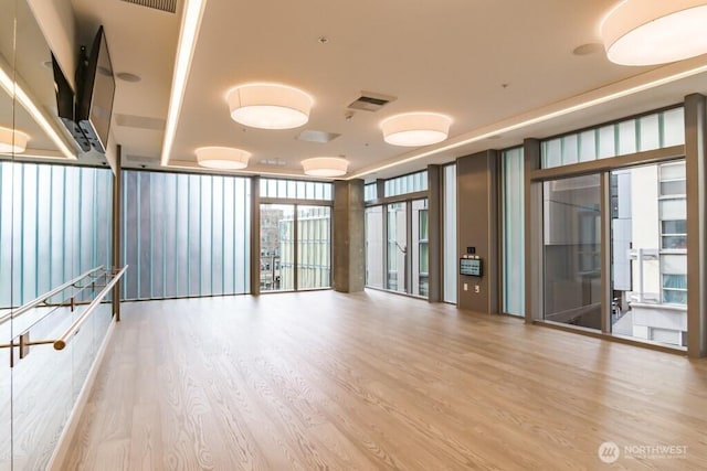 121 Stewart St Unit 905, Seattle, WA 98121 - spare room with expansive windows and wood finished floors