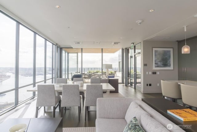 121 Stewart St Unit 905, Seattle, WA 98121 - living area with floor to ceiling windows and wood finished floors