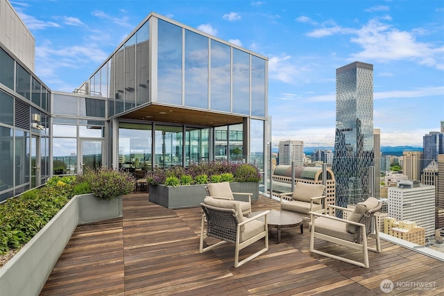 121 Stewart St Unit 905, Seattle, WA 98121 - wooden deck featuring outdoor lounge area