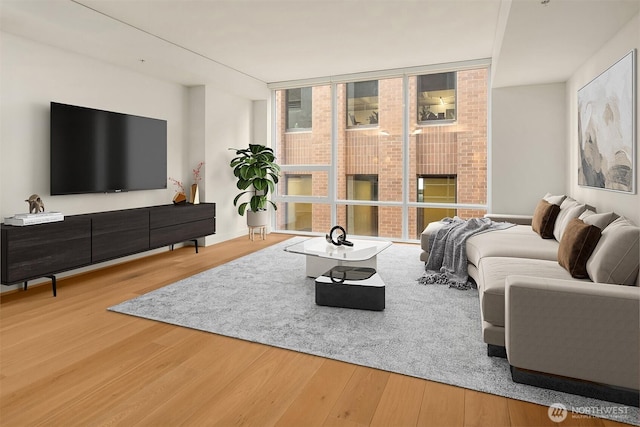 121 Stewart St Unit 905, Seattle, WA 98121 - living room with wood finished floors and floor to ceiling windows