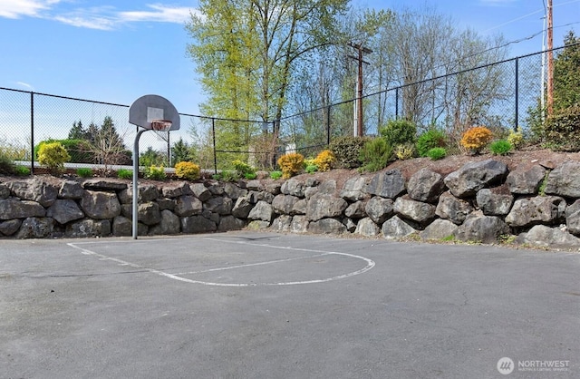 view of sport court featuring fence and community basketball court