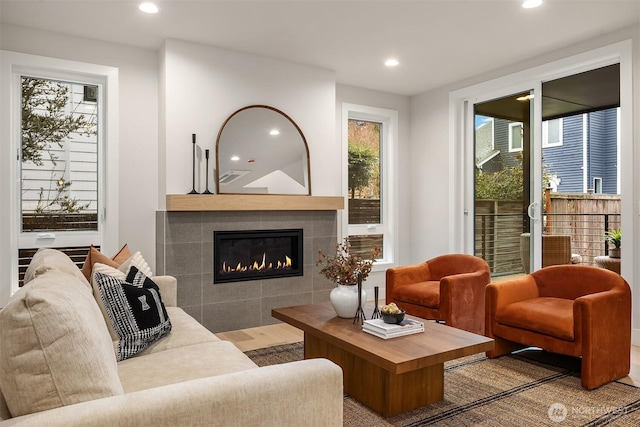 340 6th Ave, Kirkland, WA 98033 - living area featuring wood finished floors, a tile fireplace, visible vents, and recessed lighting