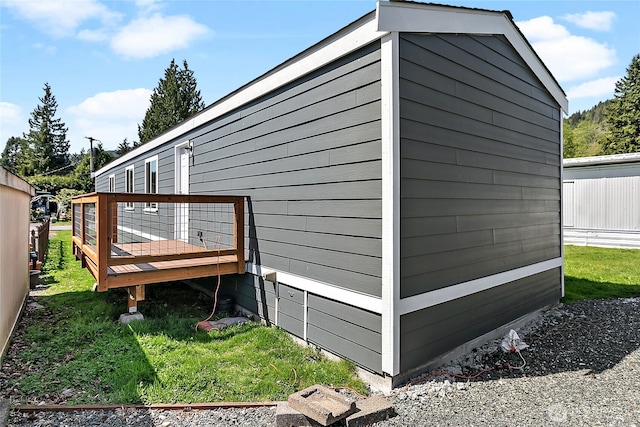 view of home's exterior with a wooden deck