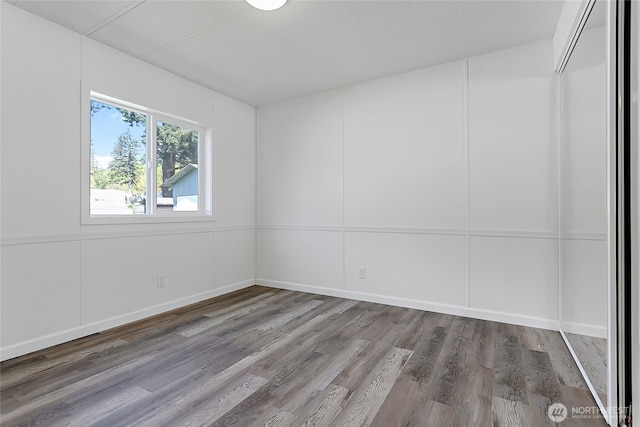 empty room with wood finished floors