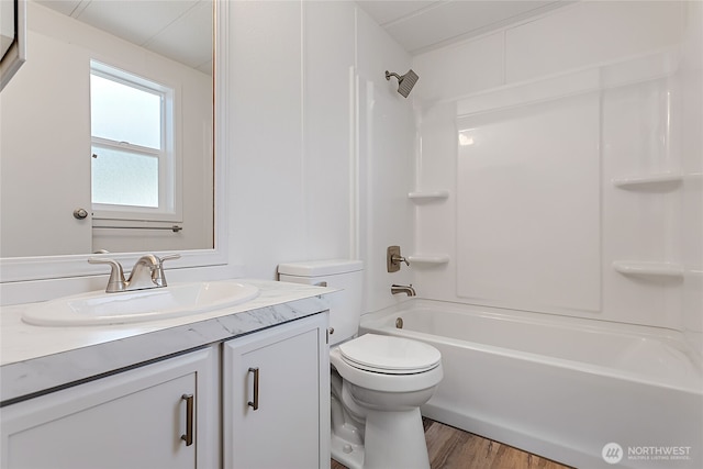full bathroom featuring toilet, shower / bath combination, vanity, and wood finished floors