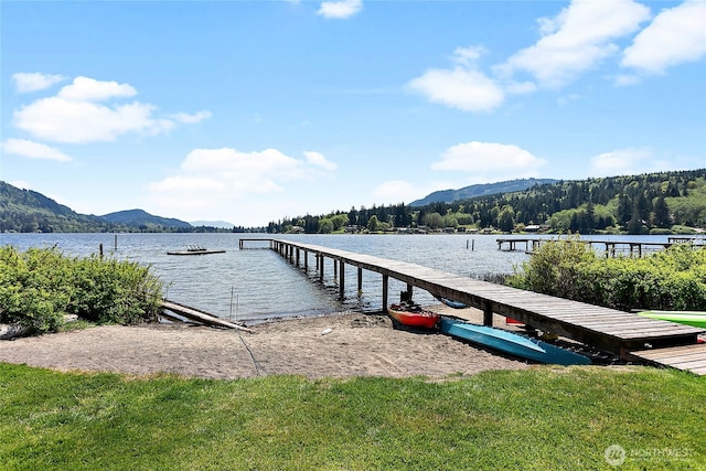 dock area featuring a water and mountain view