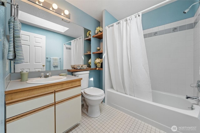 full bathroom with a skylight, vanity, tile patterned floors, toilet, and shower / bathtub combination with curtain