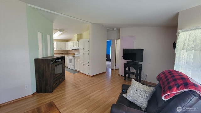 151 W Nikula Rd, Winlock, WA 98596 - living area with light wood finished floors, vaulted ceiling, and baseboards