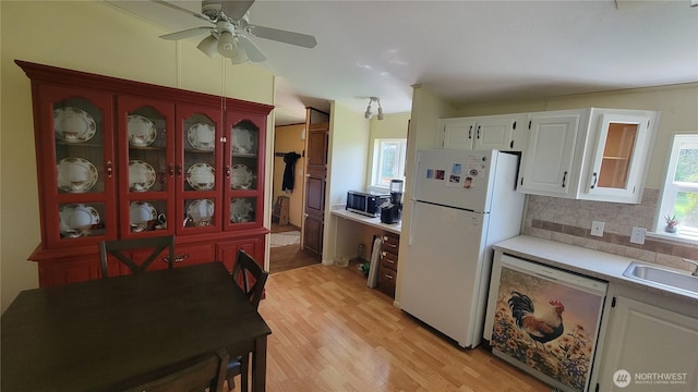 151 W Nikula Rd, Winlock, WA 98596 - kitchen featuring stainless steel microwave, a sink, dishwashing machine, light countertops, and freestanding refrigerator