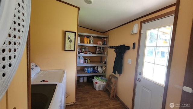 151 W Nikula Rd, Winlock, WA 98596 - clothes washing area featuring washing machine and clothes dryer, ornamental molding, laundry area, and dark wood finished floors