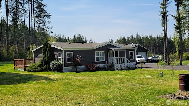 151 W Nikula Rd, Winlock, WA 98596 - view of front of property featuring driveway, a front lawn, and a garage