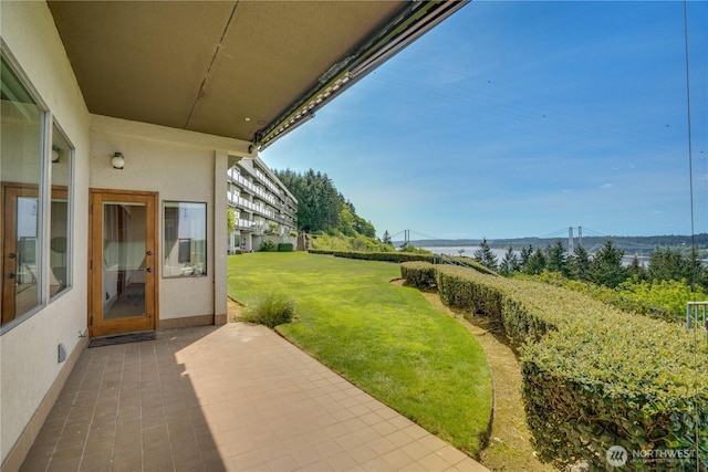 view of yard featuring a mountain view and a patio area