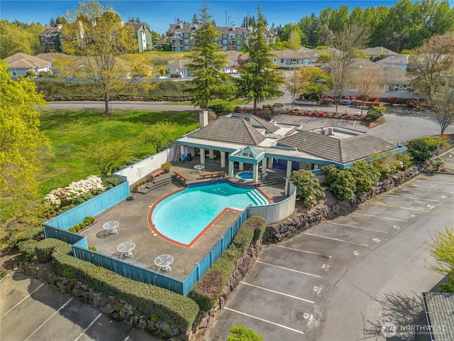 view of swimming pool with a fenced in pool, fence, and a patio