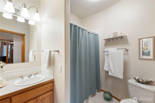 bathroom featuring toilet, tile patterned floors, a shower with shower curtain, and vanity