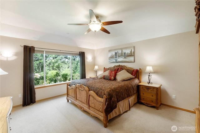 bedroom with baseboards, light colored carpet, and ceiling fan