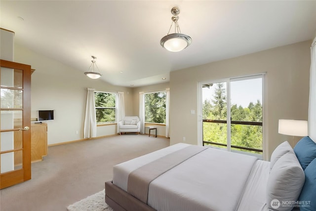 bedroom featuring baseboards, access to outside, and light carpet