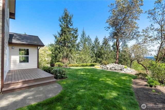 view of yard featuring a deck