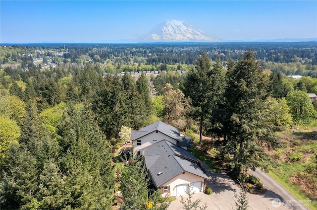 bird's eye view featuring a mountain view and a forest view