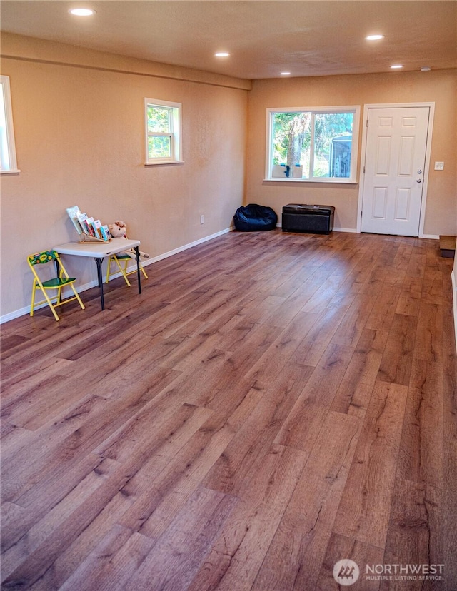 interior space featuring wood finished floors, recessed lighting, and baseboards