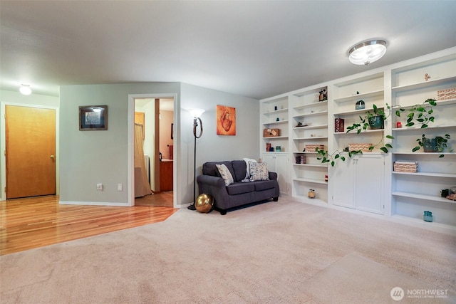 sitting room with carpet flooring and baseboards