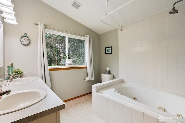 full bath featuring a tub with jets, vaulted ceiling, a shower, double vanity, and toilet