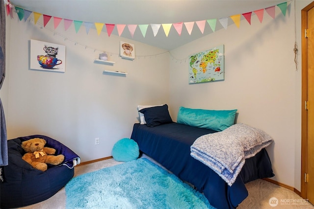 carpeted bedroom with baseboards