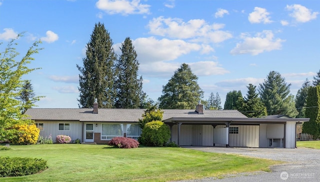 330 15th St, Snohomish, WA 98290 - view of front of home with a chimney, a front yard, a carport, and gravel driveway